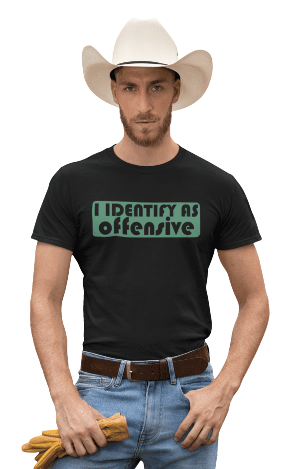 A man wearing a hat and shirt with the words " i identify as offensive ".