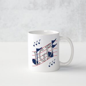 A white mug with musical notes on it.