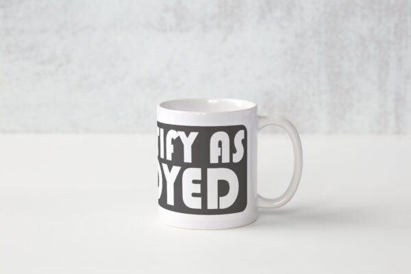 A white coffee mug with the words " try as you yed ".