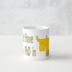 A white mug with a yellow dog and the words " i have no phd in ".