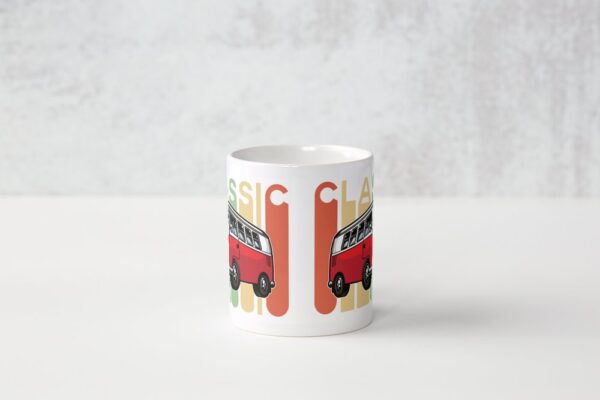 A white coffee mug with an image of a red van.