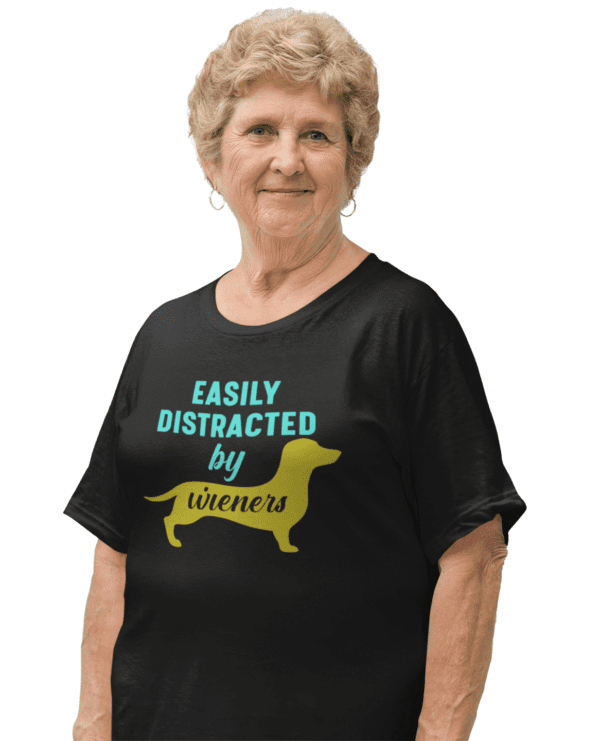 A woman wearing a black shirt with a yellow dog on it.