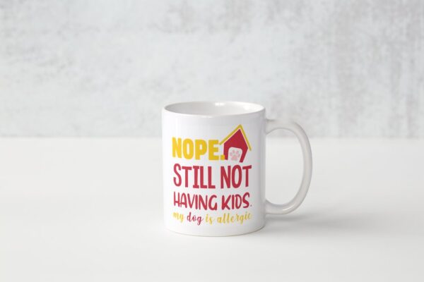 A white coffee mug with the words " nope still not having kids ".