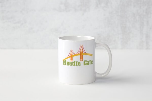 A white mug with the words noodle cafe written on it.