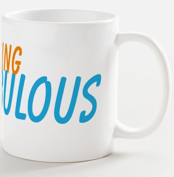 A white coffee mug with the words " being fabulous ".