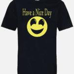 A black t-shirt with a yellow smiley face and have a nice day