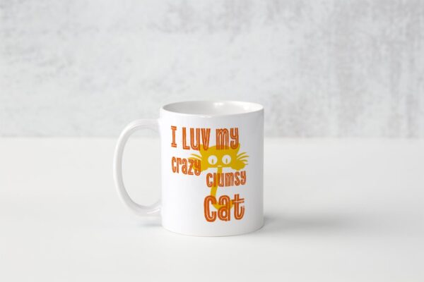 A white coffee mug with an orange cat on it.