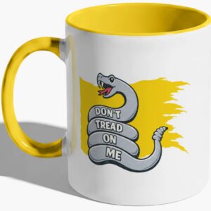 Yellow-handled mug with snake graphic design.