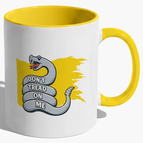 Snake design mug with bold slogan.